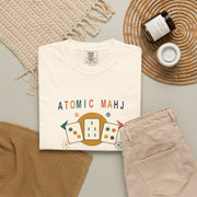 Folded butter yellow Atomic Mahj Comfort Colors shirt showing the retro Mahjong tile print.