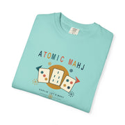 Folded chalky mint Atomic Mahj Comfort Colors shirt showing the retro Mahjong tile print in a styled product view.